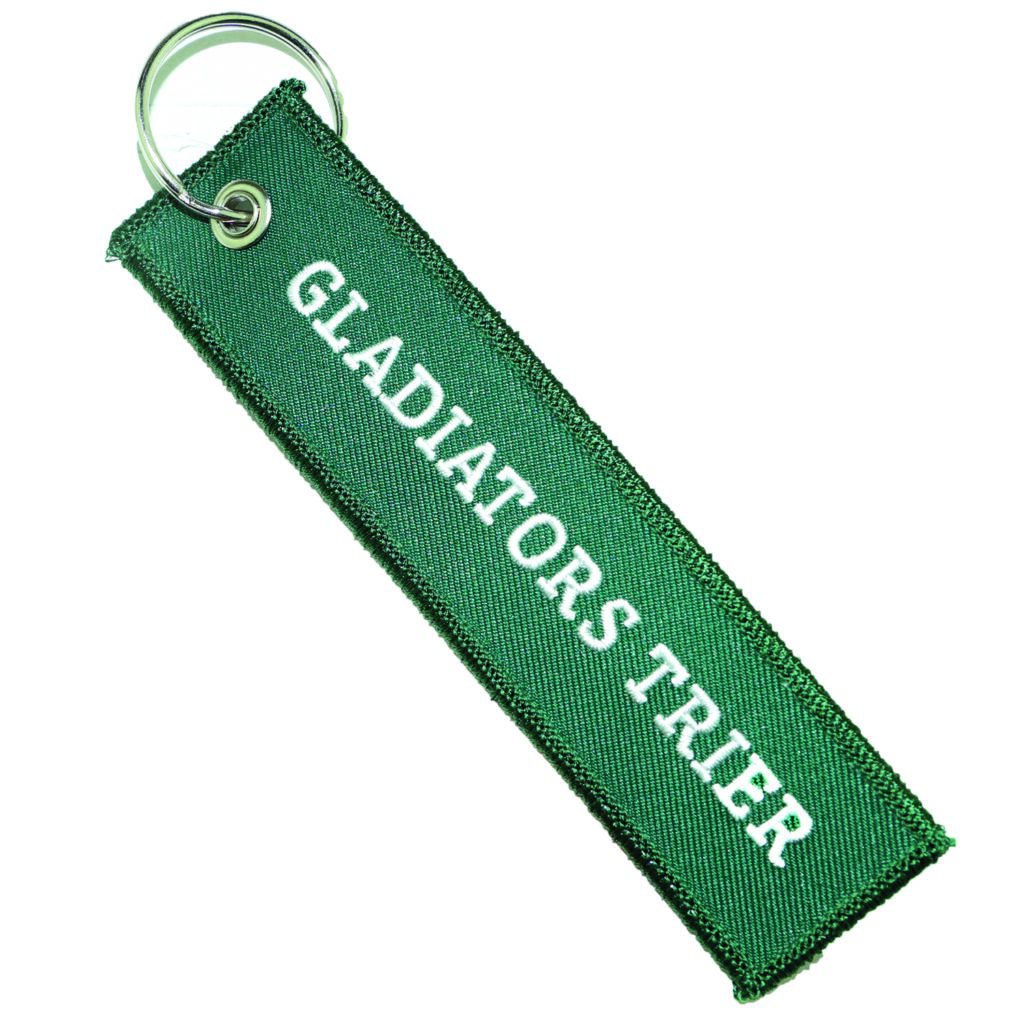 Grüner Schlüsselanhänger mit Gladiators Trier-Stick.